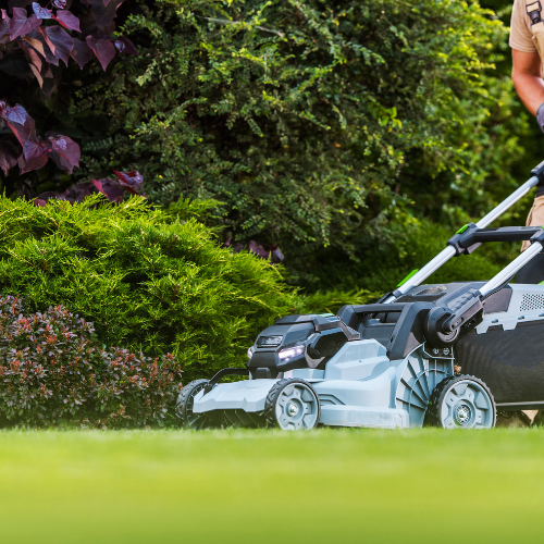 A push mower being used on a lawn